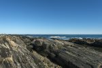 The rocky coastline on which the house sits.